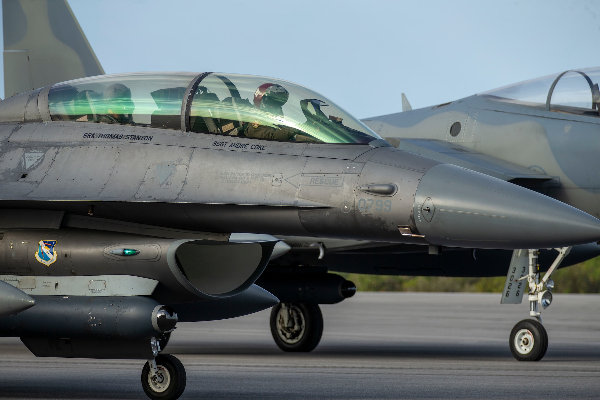 An F-16 and F-15 assigned to Eglin Air Force Base, Florida, prepare to test a datalink between two infrared search and track (IRST) pods, April 7, 2022.  The successful flight test demonstrated the ability for two dissimilar aircraft to passively range a fighter target using IRST. (U.S. Air Force photo)