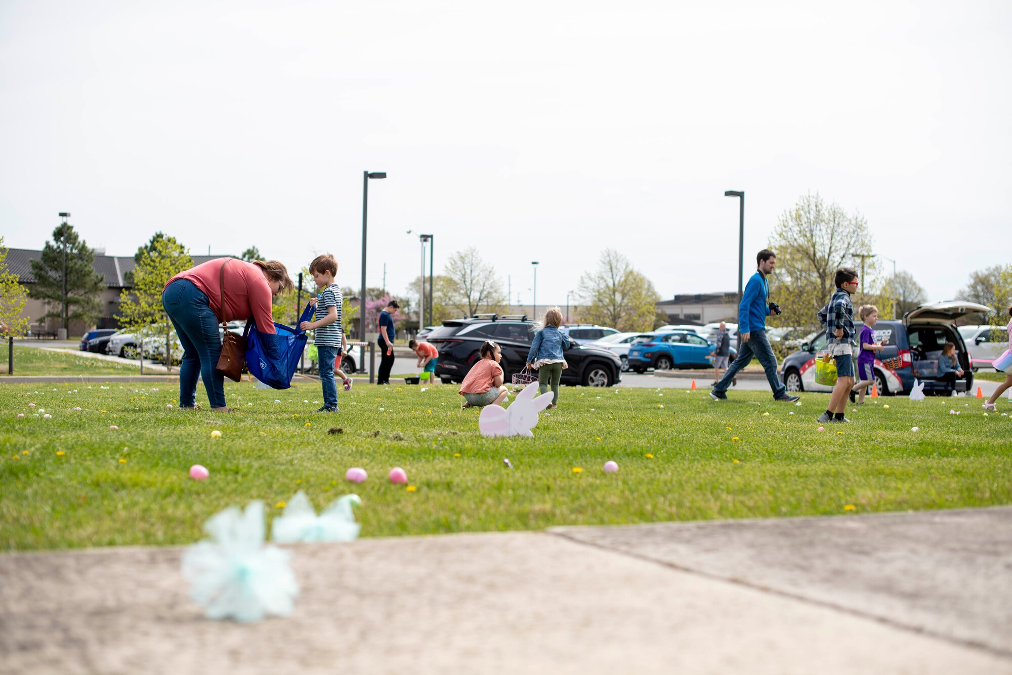 Members of Team Dover participate in the Easter egg hunt during the Easter Egg-stravaganza at Dover Air Force Base, Delaware, April 16, 2022. Hosted by the Dover AFB Chaplain Corps and USO, the hunt occurred around the base chapel and had 2,000 eggs hidden. (U.S. Air Force video by Tech. Sgt. J.D. Strong II)