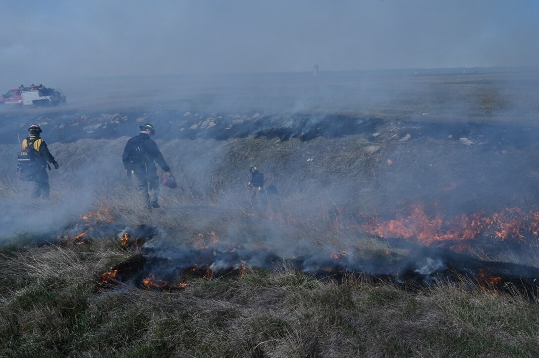 Firefighters from 28th Civil Engineer Squadron and surrounding counties conduct a prescribed burn at Ellsworth Air Force Base, S.D., April 16, 2022.