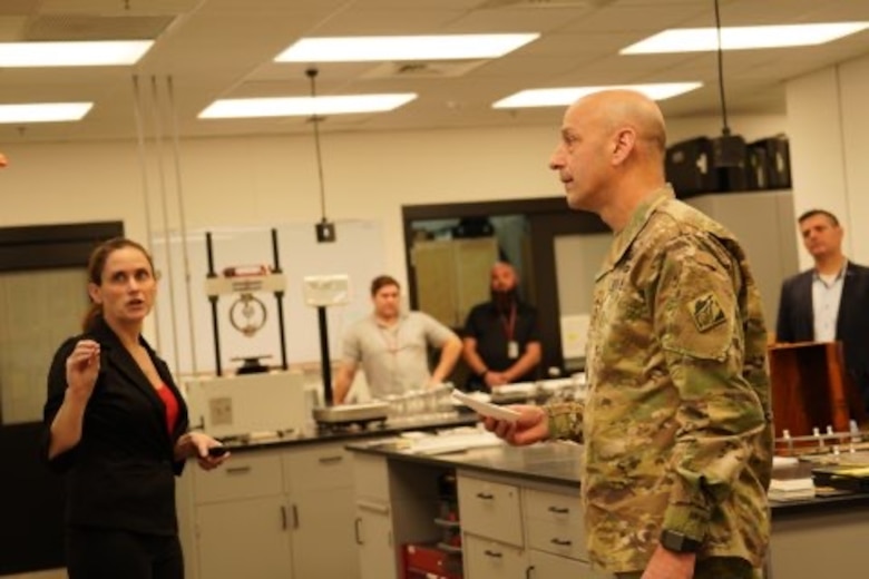 Dr. Rebekah Wilson, research scientist at the U.S. Army Engineer Research and Development Center's Construction Engineering Research Laboratory, updates Lt. Gen. Scott Spellmon, U.S. Army Corps of Engineers Commanding General and 55th Chief of Engineers, on research at the paint and technology center.