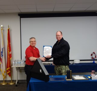 Figure 2: Doug Crowe receiving his MCSA from CAPT McKay in ceremony