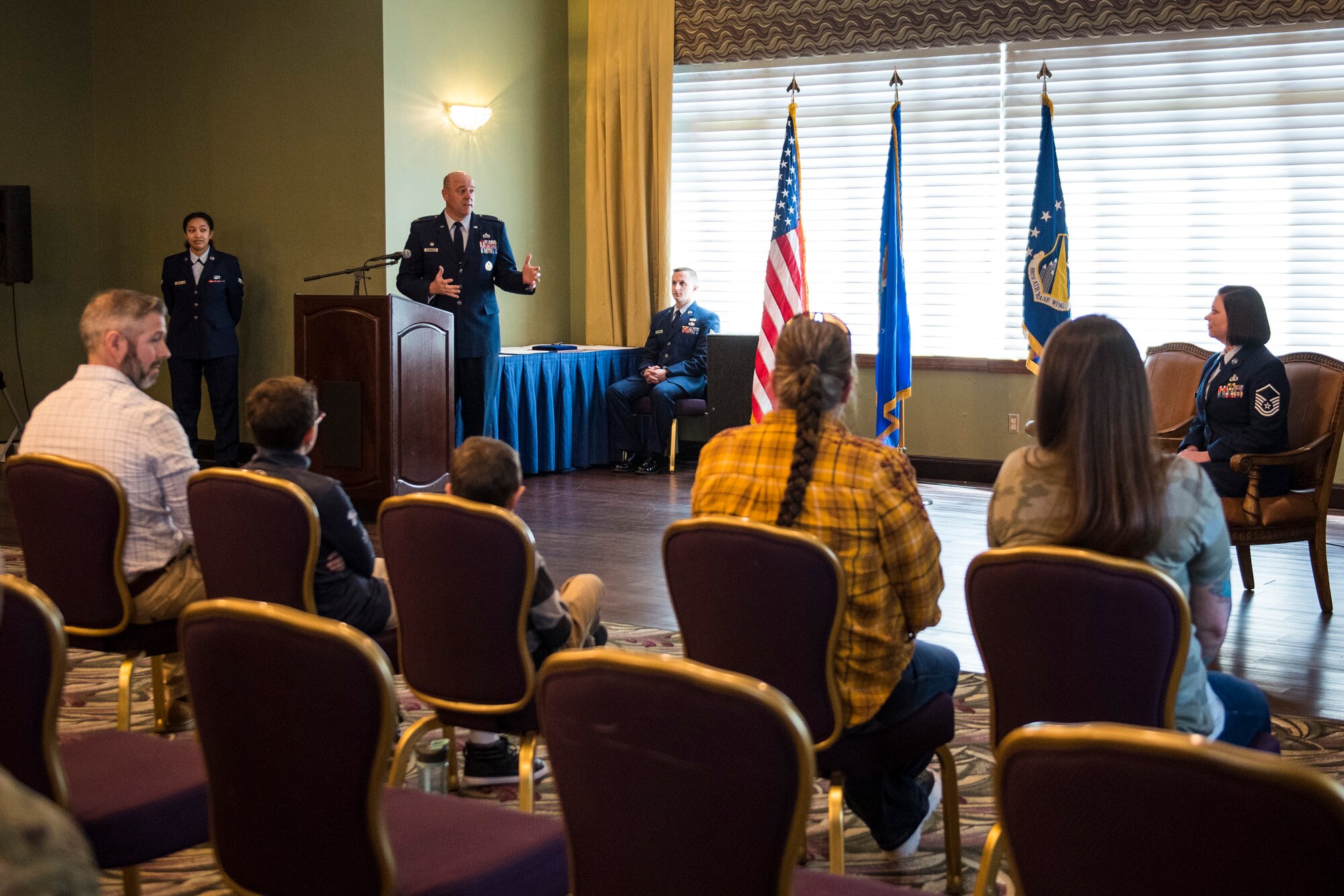 U.S. Air Force Col. Patrick Miller, 88th Air Base Wing and Installation commander, addresses Master Sgt. Wendi DiBartolomeo for during a ceremony where she was awarded the Bronze Star Medal, April 15, 2022 at Wright-Patterson Air Force Base, Ohio. DiBartolomeo was awarded the Bronze Star for her actions during Operation Allies Refuge in Kabul, Afghanistan.