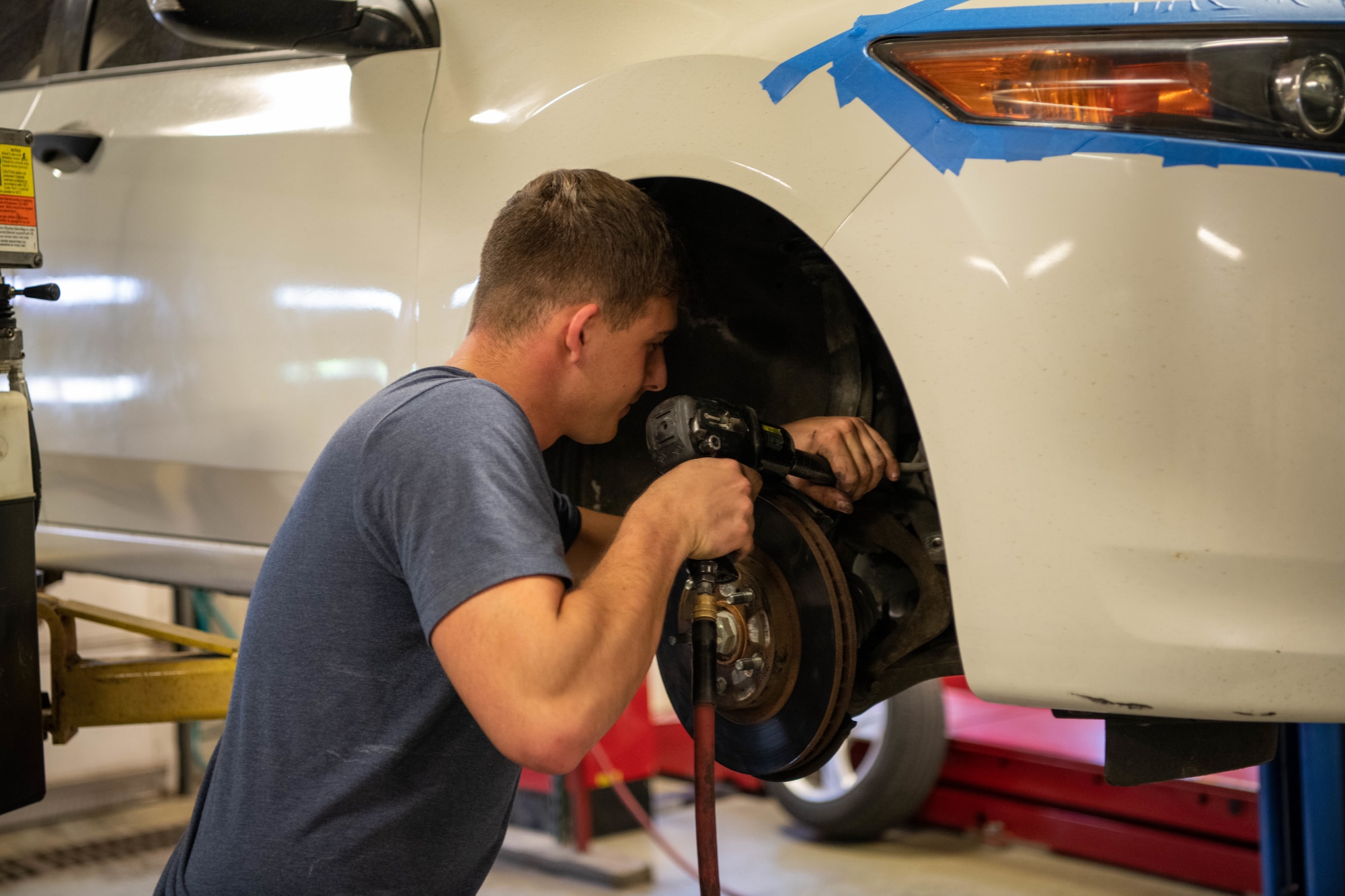 A 22nd Air Refueling Wing service member works on his suspension at the Auto Hobby Shop April 14, 2022, at McConnell Air Force Base, Kansas.