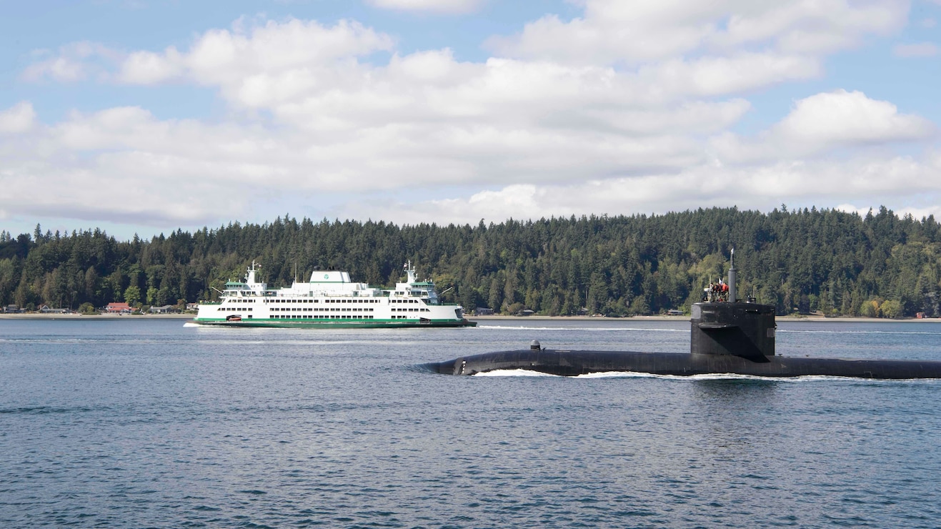The Los Angeles-class fast-attack submarine USS Providence (SSN 719) transits the Puget Sound to its new homeport of Naval Base Kitsap in Bremerton, Washington Sept. 23, 2021. Providence, the oldest active fast-attack submarine in the U.S. Navy, sailed from Groton, Connecticut and is scheduled to begin the inactivation and decommissioning process at Puget Sound Naval Shipyard.