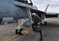 Lt. Cmdr. Mark Ramirez exits an EA-18G Growler following his first flight assigned to Electronic Attack Squadron (VAQ) 144 at Naval Air Station Whidbey Island in Oak Harbor, Washington October 4, 2021. Electronic attack squadrons operate from aircraft carriers and fixed land bases to tactically exploit, suppress, degrade and deceive enemy electromagnetic defensive and offensive systems, including communications and pro-forma signals in support of amphibious assaults, air strikes and fleet operations.