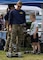 A service member, assigned to Detachment Northwest, Explosive Ordnance Disposal Mobile Unit 11, teaches a child how to navigate an unmanned ground vehicle during a National Night Out at Windjammer Park in Oak Harbor, Washington Aug. 3, 2021. National Night Out is an annual community-building campaign designed to enhance the relationship between neighbors and law enforcement. National Night Out was introduced in August of 1984 through an already established network of law enforcement agencies, neighborhood watch groups, civic groups, state and regional crime prevention associations, and volunteers across the nation.