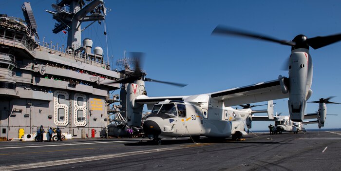 Three CMV-22B Osprey's, from the "Sunhawks" of Fleet Logistics Multi-Mission Squadron (VRM) 50, rest after landing on the flight deck of the aircraft carrier USS Nimitz (CVN 68). Nimitz is underway conducting routine operations.