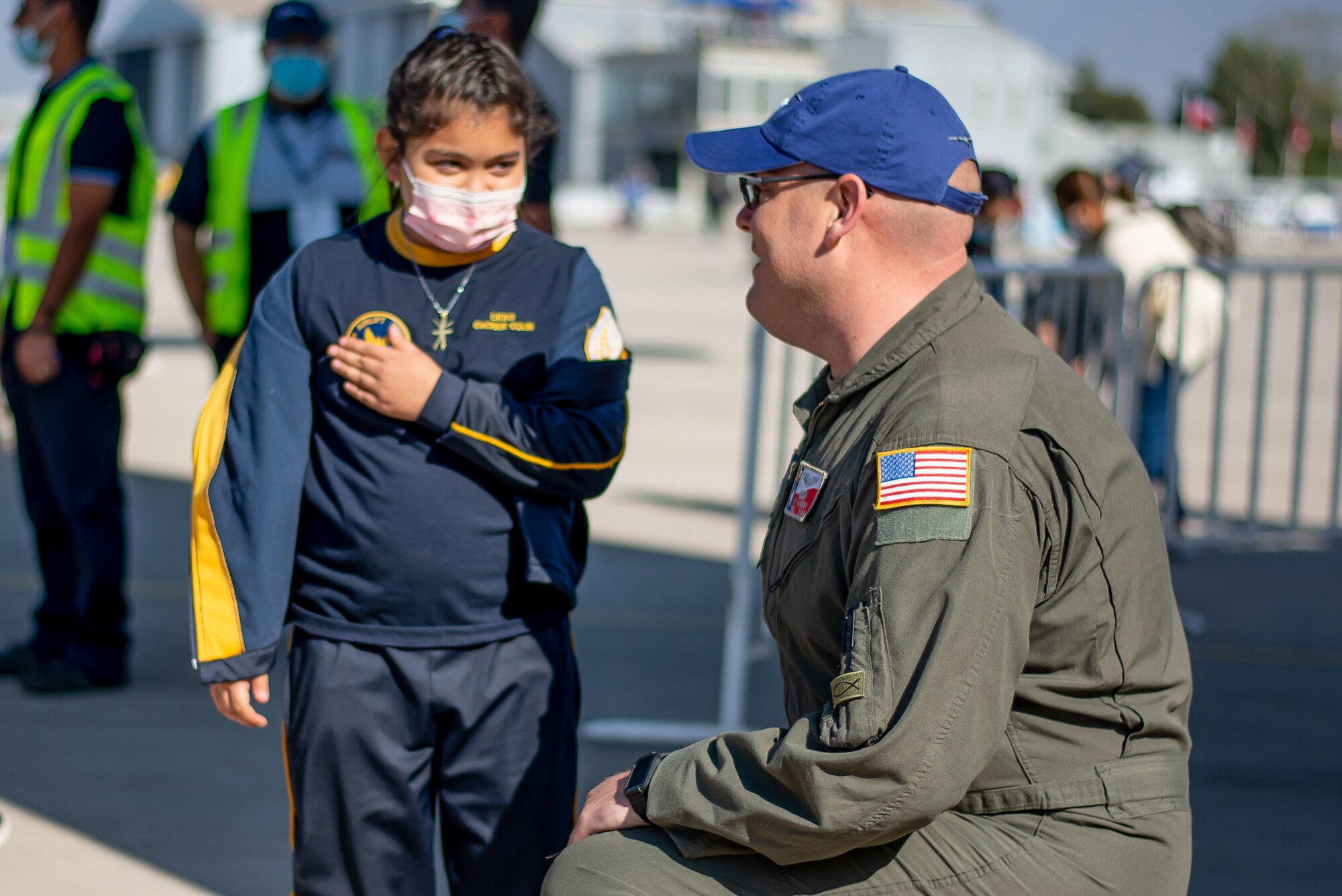 Citizen Airman talks with Chilean youth at FIDAE Air Show.