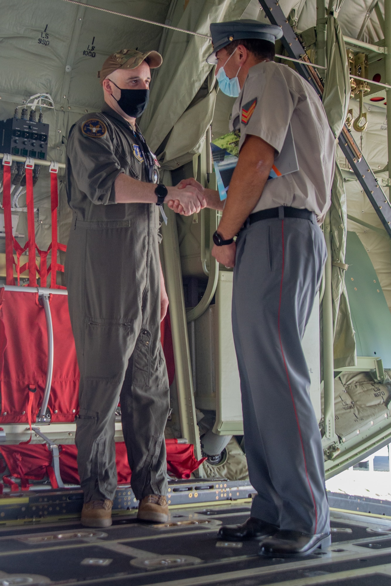 Citizen Airman discusses C-130J with Chilean service member.