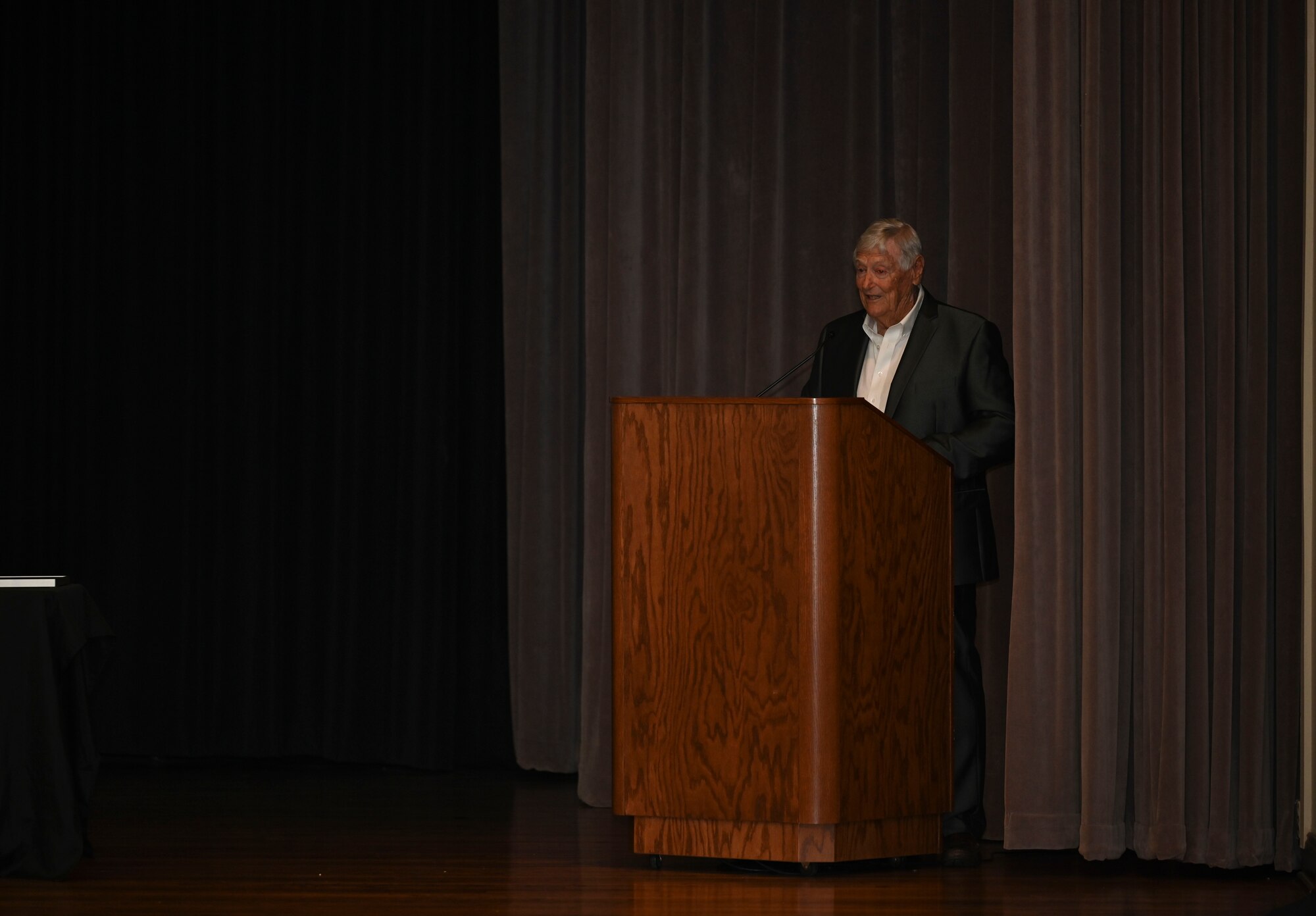 U.S. Air Force Col. Samuel Martin, retired, delivers the graduation speech, Apr. 15, 2022, at the Specialized Undergraduate Pilot Training graduation, on Columbus Air Force Base, Miss. After flying F105’s in Southeast Asia, Martin served as an Instructor Pilot at McConnelll AFB. (U.S. Air Force photo by Airman 1st Class Jessica Haynie)