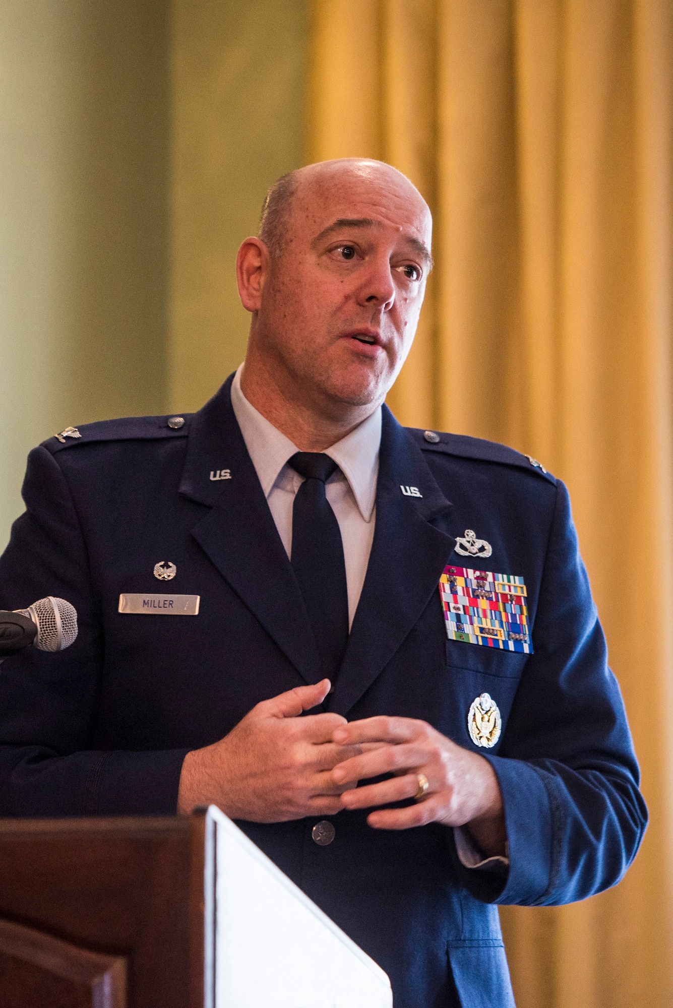 U.S. Air Force Col. Patrick Miller, 88th Air Base Wing and Installation commander, speaks during a ceremony for Bronze Star Medal recipient Master Sgt. Wendi DiBartolomeo, April 15, 2022 at Wright-Patterson Air Force Base, Ohio. DiBartolomeo was awarded the Bronze Star for her actions during Operation Allies Refuge in Kabul, Afghanistan.