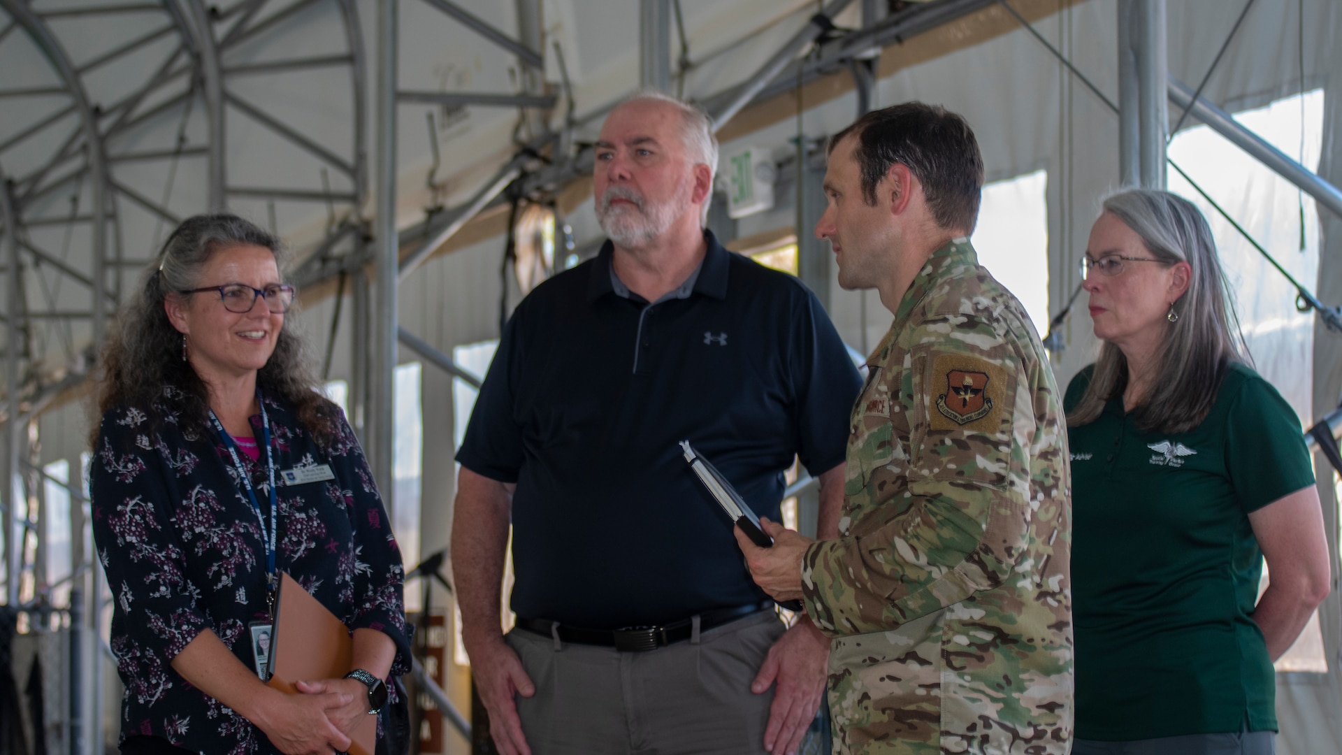 Dr. Wendy Walsh (far left), Air Education and Training Command chief learning officer, and Dr. Brian Davis (center), Second Air Force chief training officer, are briefed by Maj. Kevin Epstein (second from right), 350th Special Warfare Training Squadron commander, and Dr. Karal Garcia (far right), Special Warfare Training Group training advisor, on the Special Warfare Training Wing Pre-Dive Course at Chaparral Pool at Joint Base San Antonio-Lackland, Texas, April 5, 2022. Walsh and her team participated in an immersion tour of the SWTW to learn about how the SWTW builds Air Force Special Warfare Airmen and prepares them for combat.