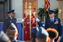 Enlisted Airmen of Air Education and Training Command induct Gen. Anthony J. Cotton, Commander, U.S. Air Force Global Strike Command and Commander, Air Forces Strategic-Air, U.S. Strategic Command, into the AETC Order of the Sword in a ceremony.