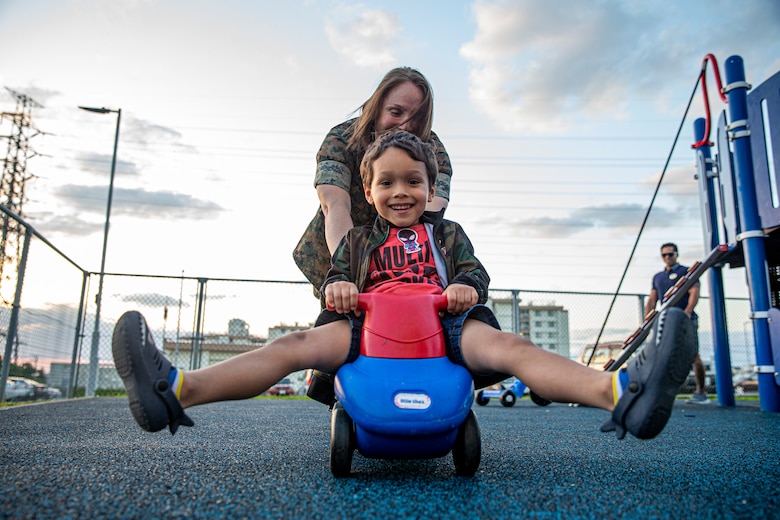 U.S. Marine Corps Staff Sgt. Felicia White, the custodian of postal effects at the Marine Corps Air Station Futenma Post Office, plays with her son, Nicky, on Camp Foster, Okinawa, Japan, April 4, 2022. Month of the Military Child, celebrated annually in April, recognizes military families and their children for the daily sacrifices and unique challenges they overcome. (U.S. Marine Corps photo by Cpl. Alex Fairchild)