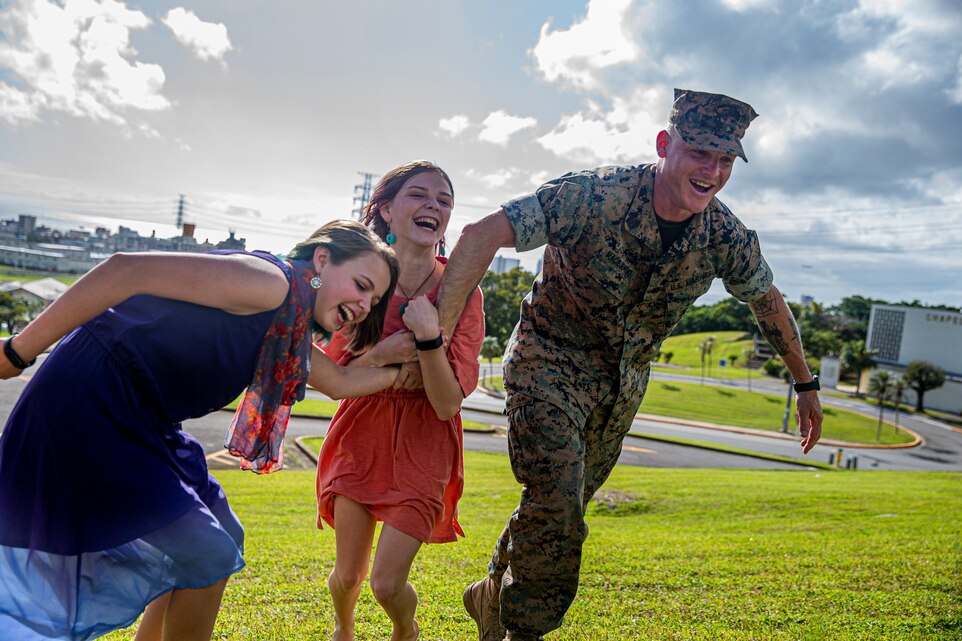 U.S. Marine Corps Gunnery Sgt. Timothy Maciejewski, the staff noncommissioned officer in charge of Provost Marshal’s Office, Headquarters and Support Battalion, Marine Corps Installations Pacific, races his daughters on Camp Foster, Okinawa, Japan, April 12, 2022. Month of the Military Child, celebrated annually in April, recognizes military families and their children for the daily sacrifices and unique challenges they overcome. (U.S. Marine Corps photo by Cpl. Alex Fairchild)