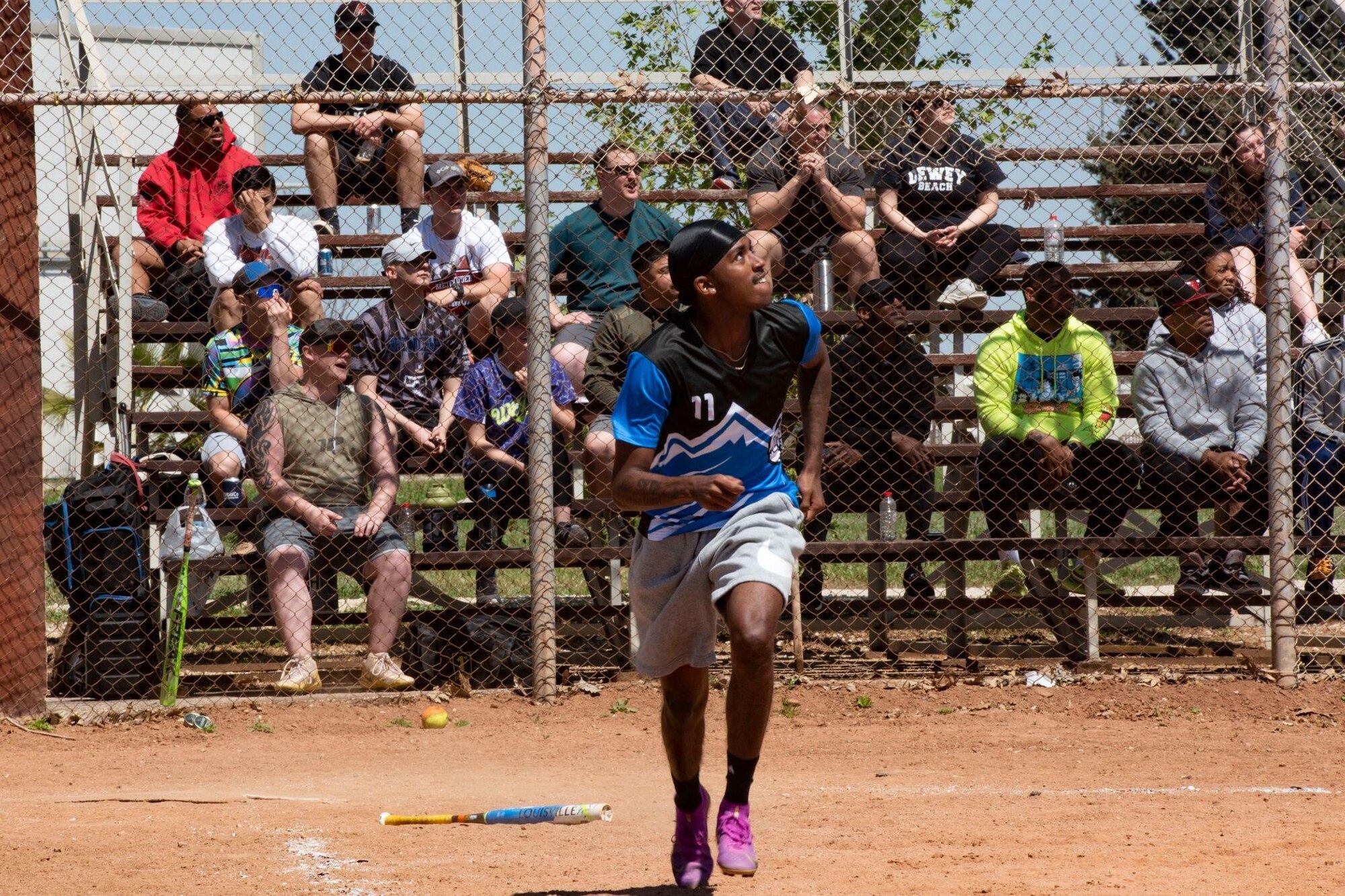 Airman 1st Class Kenesa Debela, an outbound cargo technician assigned to the 39th Logistics Readiness Squadron, participates in a softball tournament during the 39th Air Base Wing sports day at Incirlik Air Base, Turkey, April 14, 2022. During the event, U.S. military members, civilians, Turkish local national employees and NATO allies competed in a series of scored athletic events and activities to kick off the spring season. The day concluded with a closing ceremony where the highest ranking teams were awarded trophies or medals. (U.S. Air Force photo by Staff Sgt. Gabrielle Winn)