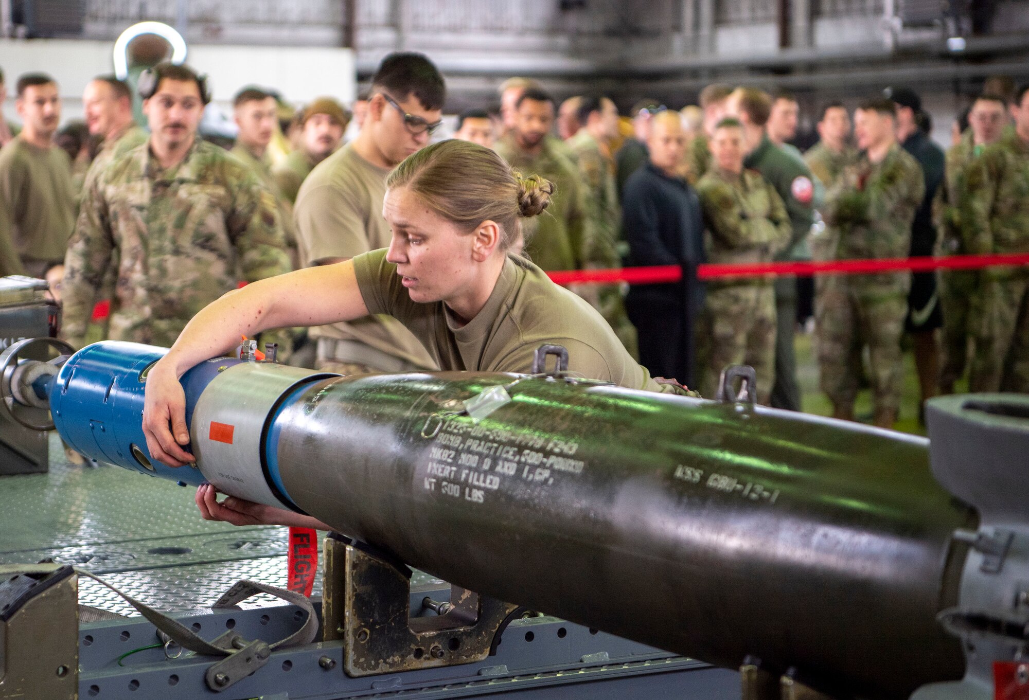 Senior Airman Kelsey Underhile, 34th Fighter Generation Squadron weapons crew member, prepares to load a GBU-12 paramount onto an F-35A Lightning II fifth-generation fighter aircraft during the Weapons Load Crew of the Quarter competition at Spangdahlem Air Base, Germany, April 14, 2022. Monthly competitions provide an opportunity for load crews to earn their spot in the quarterly competitions. (U.S. Air Force photo by Airman 1st Class Jessica Sanchez-Chen)