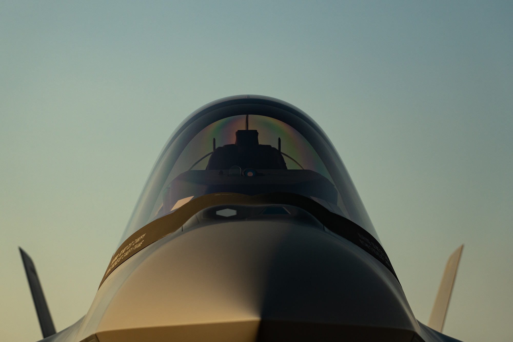 Photo of a fighter jet during sunset