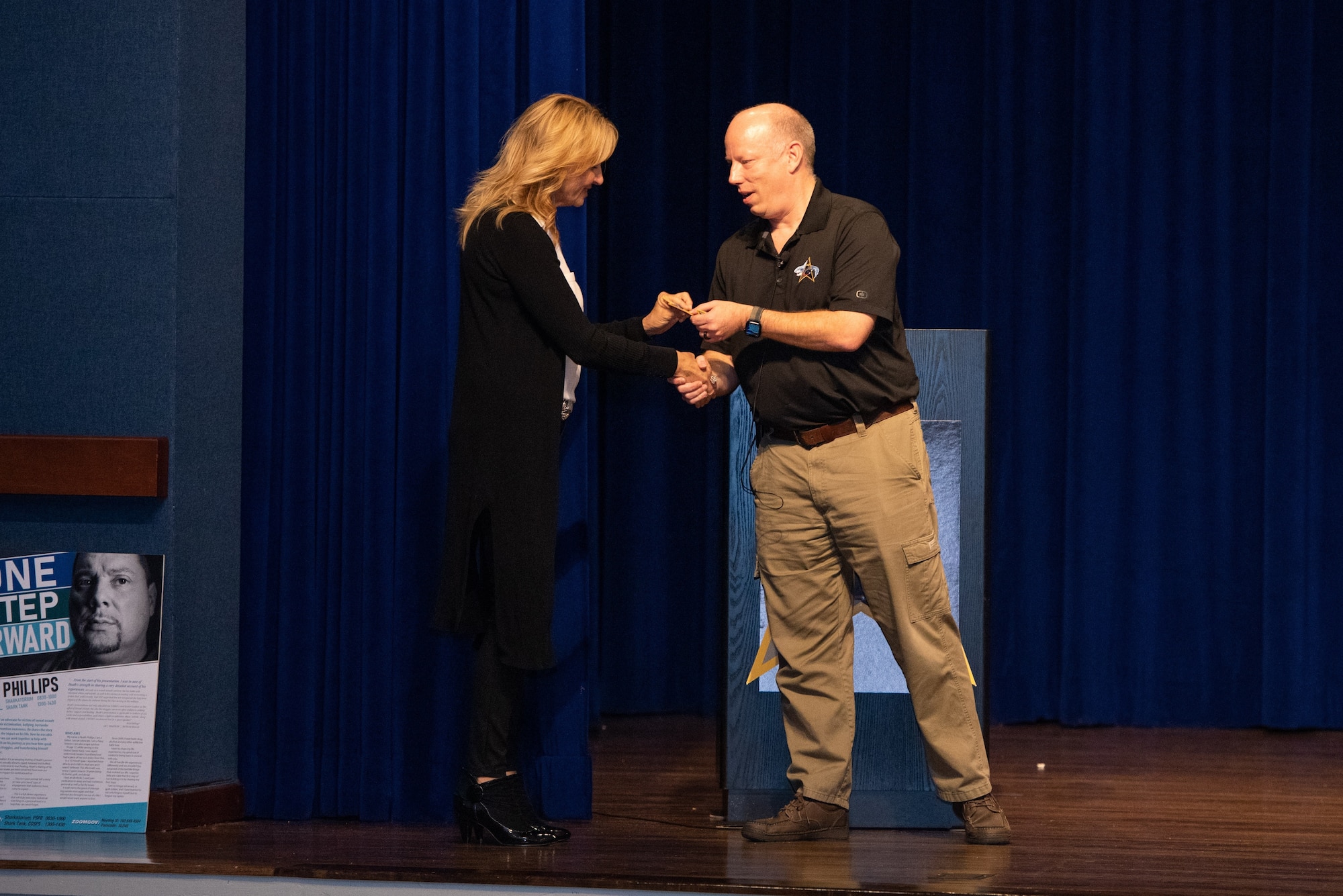 U.S. Space Force Brig. Gen. Stephen Purdy, right, Space Launch Delta 45 commander, presents an SLD 45 patch to Elaine Larsen, a two-time world champion drag racer, April 15, 2022, during Resilience Day at Patrick Space Force Base, Florida. Larsen was one of two guest speakers at the event and spoke about overcoming adversity. (U.S. Space Force photo by Amanda Inman)