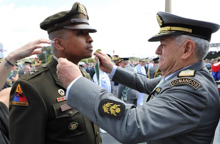 Maj. Gen. William L. Thigpen is presented with the Brazilian Order of Military Merit medal by the Minister General of the Brazilian Army Gen. Luis Carlos Gomes Mattos during the Brazilian Army Day, April 19, celebrating the Army's 374th birthday. The Order of Merit is the highest honorary distinction of the Brazilian Army.