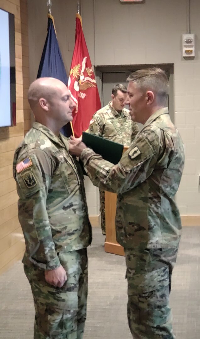 U.S. Staff Sgt. Andrew Fryburg, chief instructor at the 24th Regimental Training Institute’s modular training battalion was presented with the Master Instructor Badge on April 19, 2022, by Col. William Wagner, RTI Commanding Officer.  Fryburg is the first Vermont National Guard RTI instructor to have attained the Master Instructor Badge which requires 500 hours of study.  (U.S. Army National Guard photo by Joshua T. Cohen)