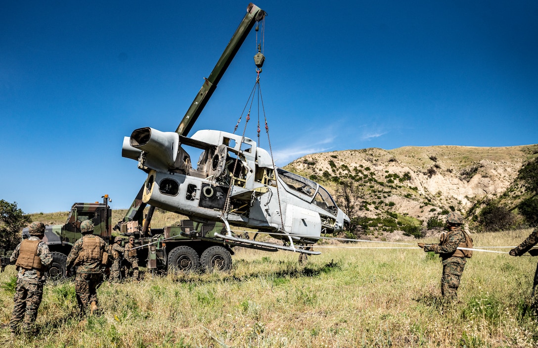 U.S. Reserve Marines with Marine Wing Support Squadron (MWSS) 473, 4th Marine Aircraft Wing, conduct an aircraft salvage and recovery exercise during a training scenario at Marine Corps Base Camp Pendleton, California, April 9, 2022. The Marines of MWSS-473 will use this training as practice towards a certification exercise during integrated training exercise, which takes place at Marine Corps Air Ground Combat Center Twentynine Palms, California. (U.S. Marine Corps photo by Sgt. Matthew Teutsch)
