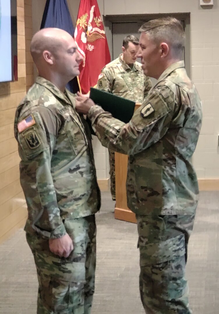 U.S. Staff Sgt. Andrew Fryburg, chief instructor at the 24th Regimental Training Institute’s modular training battalion, was presented with the master instructor badge, April 19, 2022, by Col. William Wagner, RTI commanding officer. Fryburg is the first Vermont National Guard RTI instructor to have attained the master instructor badge, which requires 500 hours of study.