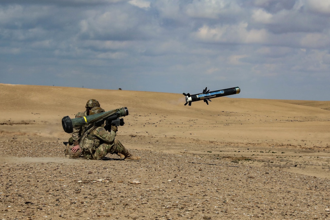 A soldier launches a shoulder-fired anti-tank missile.
