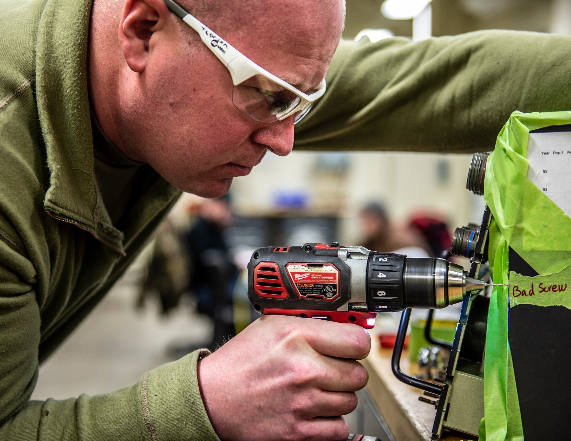 U.S. Air Force Tech. Sgt. Tyler Corson, 133rd Maintenance Squadron, drills out a bad screw in St. Paul, Minn., April 7, 2022.