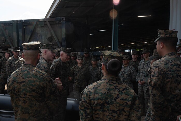 U.S. Marine Corps Gen. David Berger, the Commandant of the Marine Corps and Sgt. Maj. of the Marine Corps Troy Black, interact with Marines from Marine Rotational Force-Darwin 22, during a tour in Darwin, NT, Australia, April 14, 2022. Gen. Berger’s visit allowed Australian and American service members to showcase how they enhance interoperability.