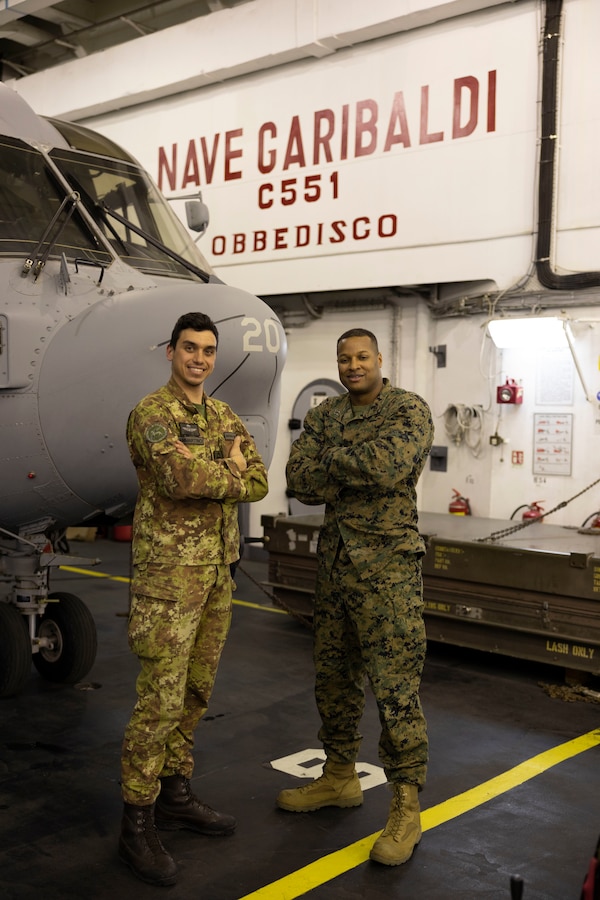 U.S. Marine Corps Capt Westley, 2nd Marine Expeditionary Brigade stands next to Italian San Marco marine LT Niccolo Sammartino pose for a photo during exercise Cold Response '22 on March 31, 2022 in the Norwegian Sea. Exercise Cold Response '22 is a biennial Norwegian national readiness and defense exercise that takes place across Norway, with participation from each of its military services, as well as from 26 additional North Atlantic Treaty Organization (NATO) allied nations and regional partners. (U.S. Marine Corps photo by Staff Sgt Shawn P. Coover)