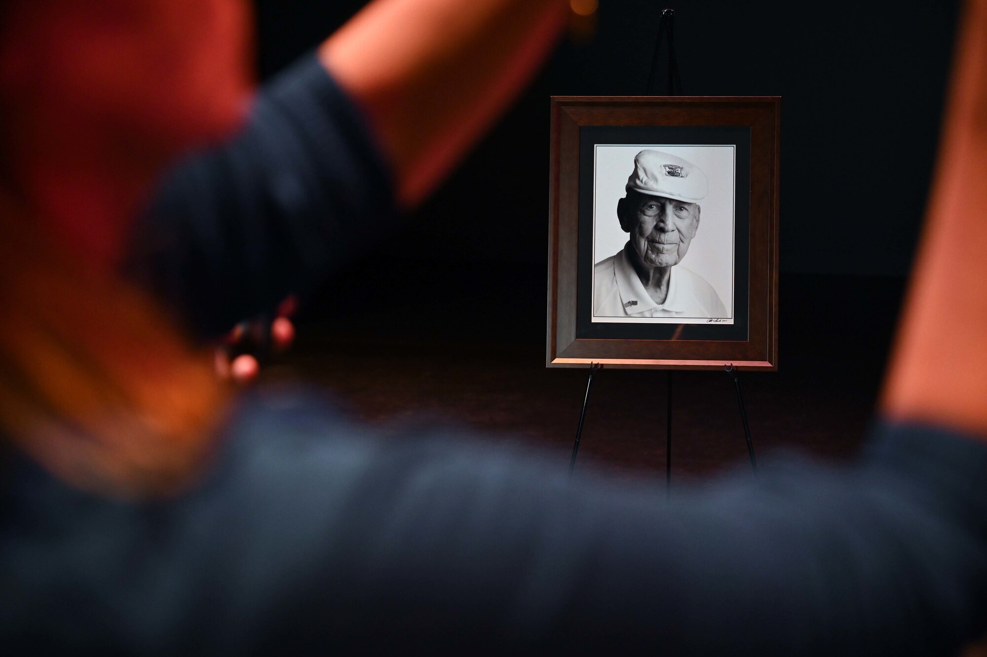 A photo of Col. (ret.) Dick Cole, the last surviving Doolittle Raider, is on display during the final Doolittle Raider Goblet Ceremony at the Mattie Kelly Arts Center at Northwest Florida State College, Niceville, Florida, April 18, 2022. The ceremony marked the 80th Anniversary of the Doolittle Raid, also known as the Tokyo Raid, which was the first air operation to directly strike the mainland of Japan during World War II. (U.S. Air Force photo by Staff Sgt. Brandon Esau)