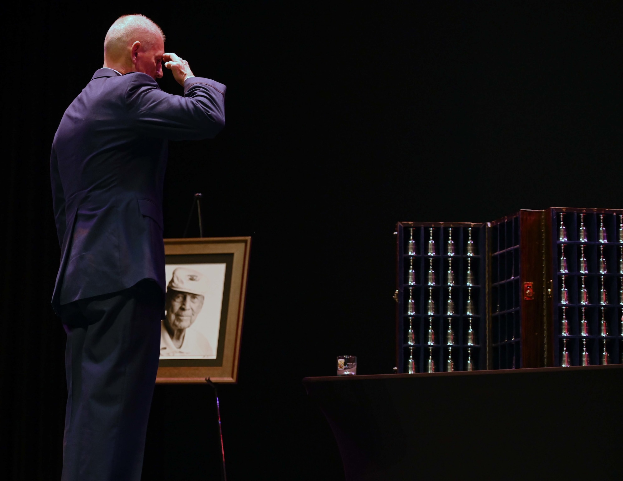 U.S. Air Force Lt. Col. (ret.) Richard Cole, son of Col. (ret.) Dick Cole, the last surviving Doolittle Raider, salutes his father’s goblet during the Doolittle Raider Goblet Ceremony at the Mattie Kelly Arts Center at Northwest Florida State College, Niceville, Florida, April 18, 1942. On April 18, 1942, Airmen of the U.S. Army Air Forces flew 16 North American B-25 medium bombers aboard the U.S. Navy carrier USS Hornet to a location within take-off distance from the Japanese islands for a direct air operation against Tokyo. (U.S. Air Force photo by Staff Sgt. Brandon Esau)