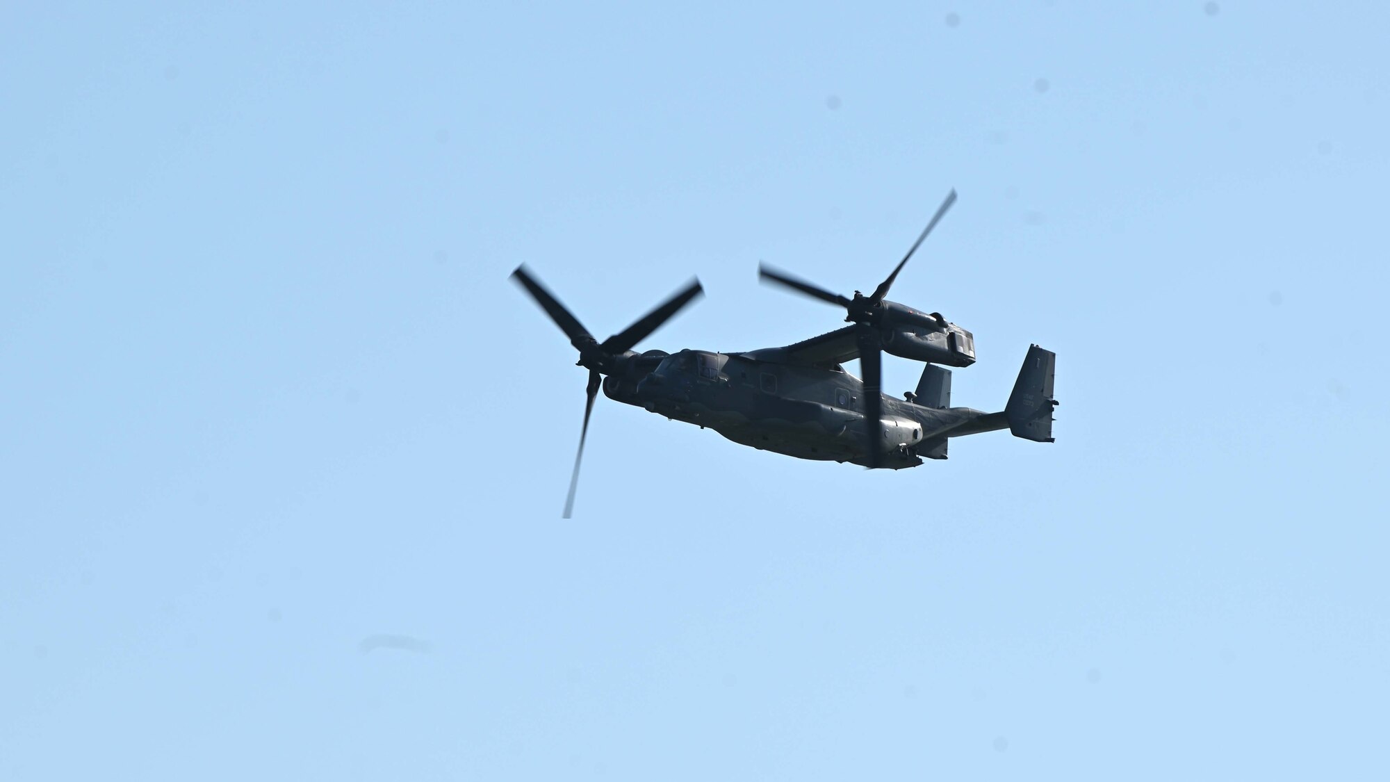 A U.S. Air Force CV-22 Osprey from the 8th Special Operations Squadron, 1st Special Operations Wing, Hurlburt Field, Florida, flies over Okaloosa Island, Florida, during an aerial review in honor of the Doolittle Raiders April 18, 2022. The review featured 30 vintage and current U.S. Air Force aircraft and included a B-25 Mitchell bomber, a B-52 Stratofortress, an F-22 Raptor, and an F-35 Lightning II among others. (U.S. Air Force photo by Staff Sgt. Brandon Esau)