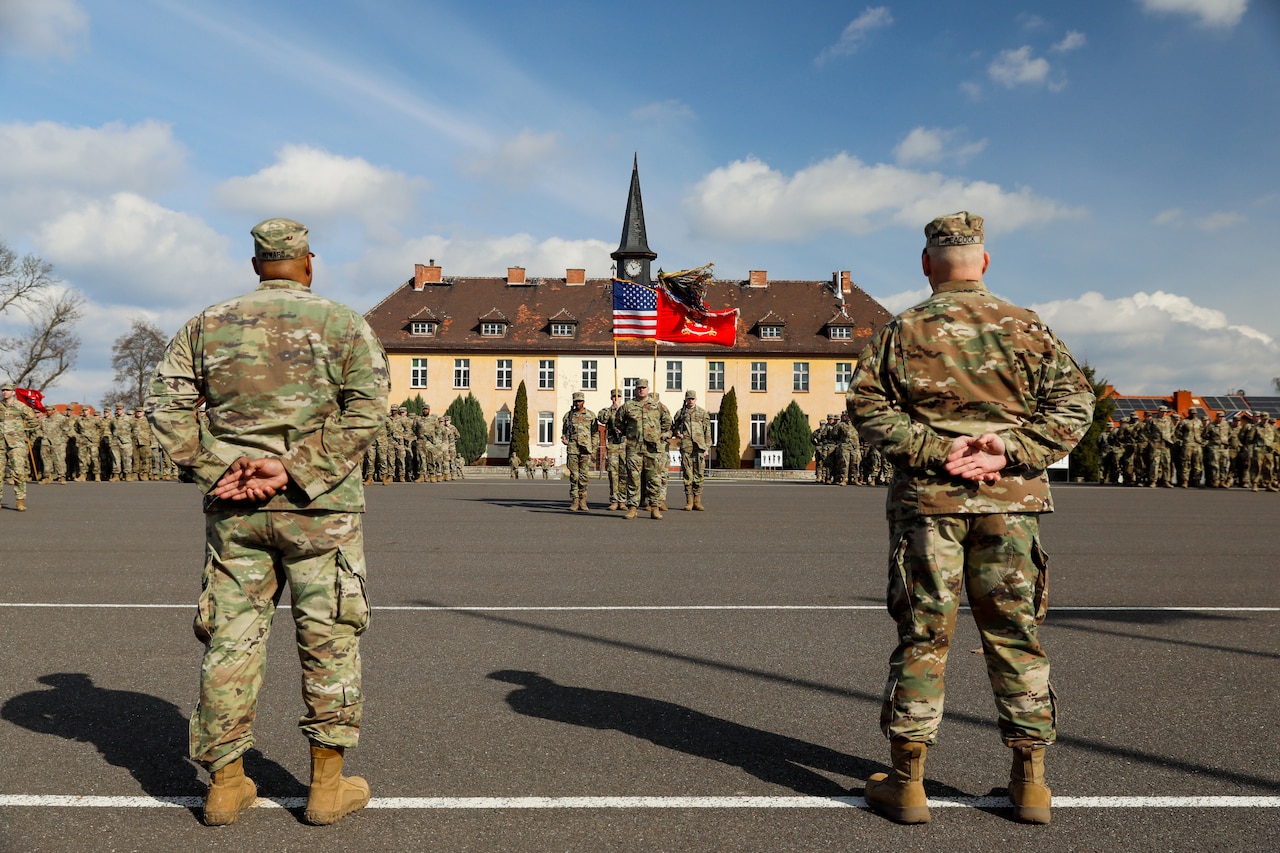 Soldiers stand in formation.