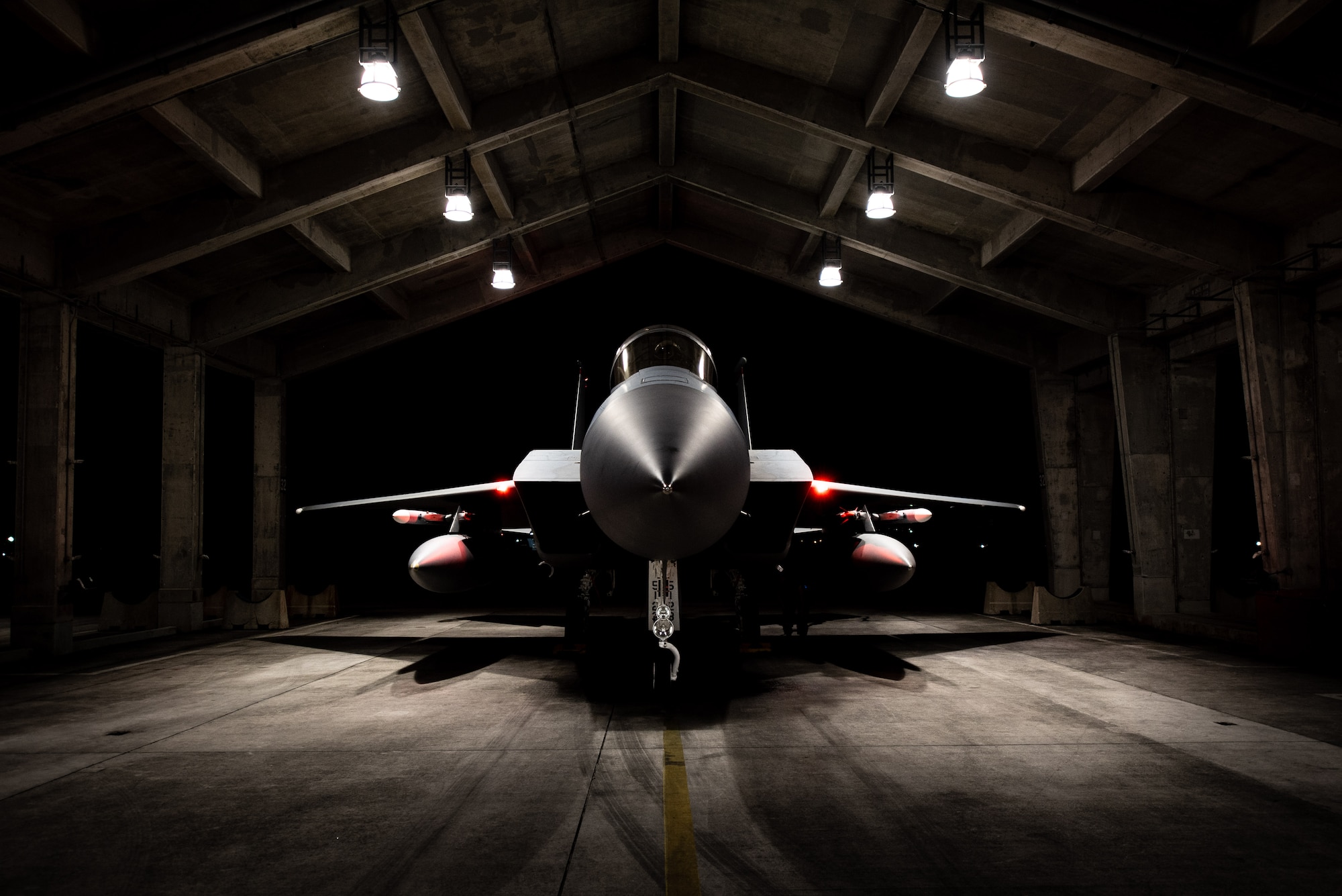 An F-15C Eagle assigned to the 67th Fighter Squadron is postured in a hangar before departing for Red Flag-Alaska at Kadena Air Base, Japan, April 15, 2022. This exercise reinforces the United States’ continued commitment to the region as a Pacific nation, leader and power. (U.S. Air Force photo by Airman 1st Class Sebastian Romawac)