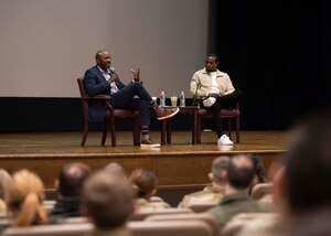 Retired Chief Master Sgt. of the Air Force Kaleth O. Wright and cycling instructor Alex Toussaint discuss mental health and awareness at Joint Base Andrews, Md., April 19, 2022.