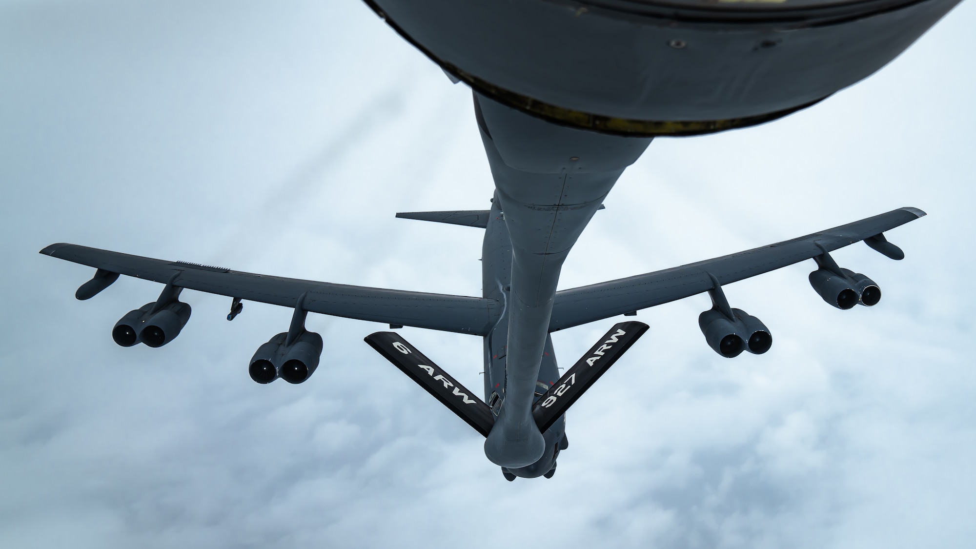 A B-52 Stratofortress aircraft assigned to the 2nd Bomb Wing approaches a KC-135 Stratotanker aircraft assigned to the 6th Air Refueling Wing over Louisiana, April 12, 2022.