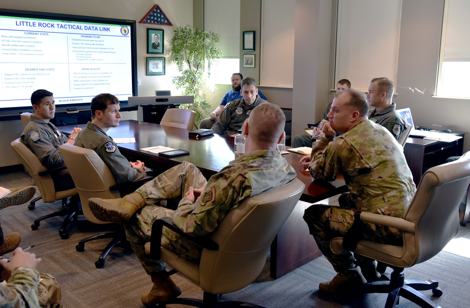 Maj. Gen. Kenneth Bibb, 18th Air Force commander, and Chief Master Sgt. Chad Bickley, 18th Air Force command chief, meet with senior leaders from the 19th Operations Group to discuss C-130J Super Hercules operations