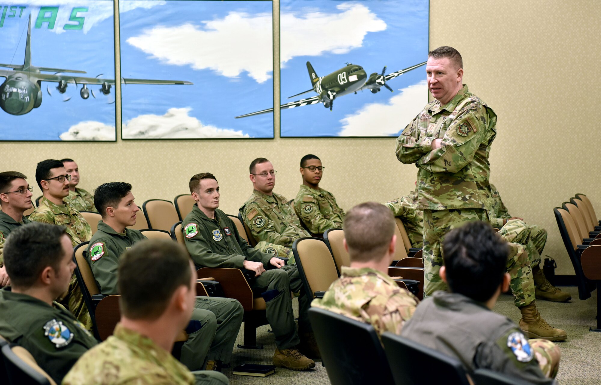 Chief Master Sgt. Chad Bickley, 18th Air Force command chief, gives a brief to Airmen assigned to Little Rock Air Force Base, Arkansas during a visit to the installation