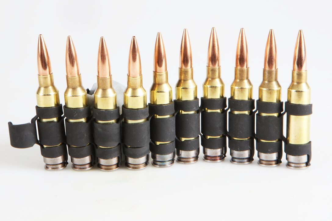 Ten bullets are lined up in a row.