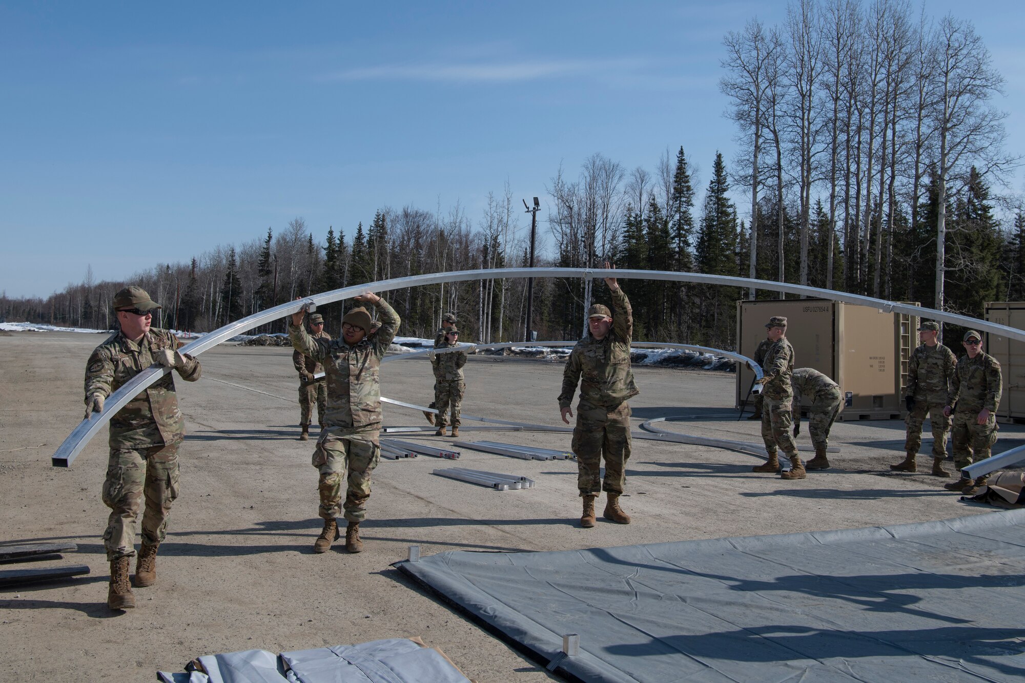 A photo of men erecting