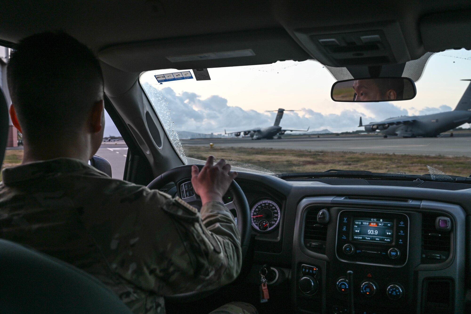 Staff Sgt. Chun Jiang, 15th Operations Support Squadron airfield management operations supervisor, operates a government-owned vehicle during a morning flight line inspection at Joint Base Pearl Harbor-Hickam, Hawaii, April 20, 2022. Inspections are performed every day bi-hourly, ensuring a safe and operational flight line in support of military, civilian and allied aircraft. (U.S. photo by Staff Sgt. Alan Ricker)