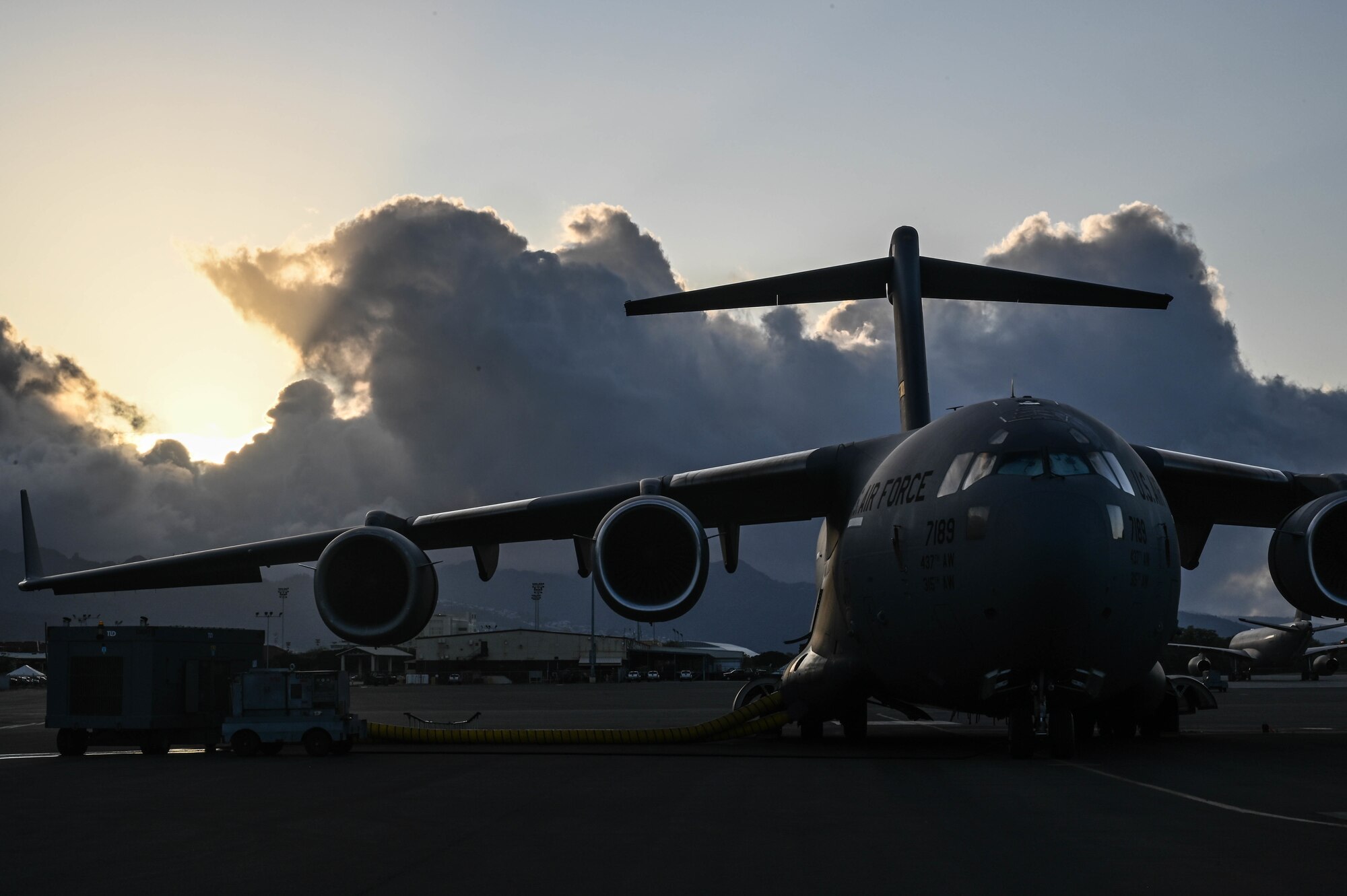 A C-17 Globemaster III is prepared for a flying operation at Joint Base Pearl Harbor-Hickam, Hawaii, April 20, 2022. The C-17 provides rapid strategic delivery of troops and cargo to main operating bases or to forward bases across the world. (U.S. Air Force photo by Staff Sgt. Alan Ricker)