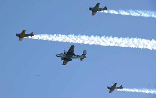 Four vintage U.S. Army Air Forces perform a missing man formation during an aerial review in honor of the Doolittle Raiders over Okaloosa Island, Florida, April 18, 2022. The review featured 30 vintage and current U.S. Air Force aircraft and included a B-25 Mitchell bomber, a B-52 Stratofortress, an F-22 Raptor, and an F-35 Lightning II among others. (U.S. Air Force photo by Staff Sgt. Brandon Esau)