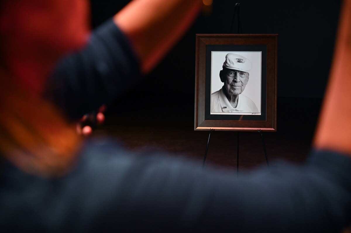 A photo of Col. (ret.) Dick Cole, the last surviving Doolittle Raider, is on display during the final Doolittle Raider Goblet Ceremony at the Mattie Kelly Arts Center at Northwest Florida State College, Niceville, Florida, April 18, 2022. The ceremony marked the 80th Anniversary of the Doolittle Raid, also known as the Tokyo Raid, which was the first air operation to directly strike the mainland of Japan during World War II. (U.S. Air Force photo by Staff Sgt. Brandon Esau)