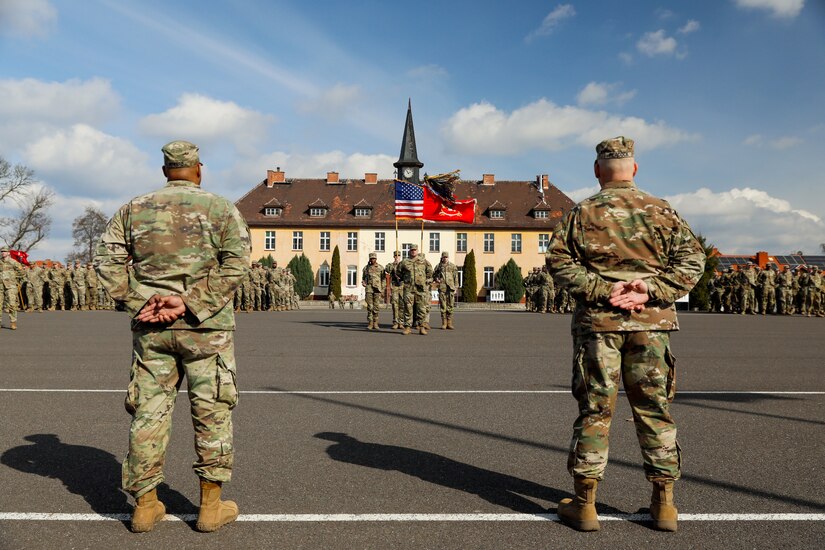 Soldiers stand in formation.