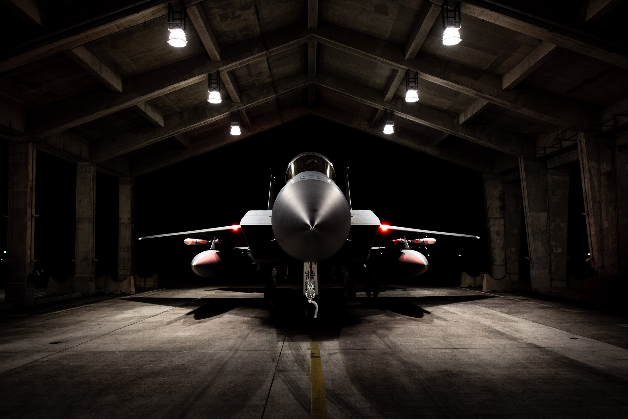 An F-15C Eagle assigned to the 67th Fighter Squadron is postured in a hangar before departing for Red Flag-Alaska at Kadena Air Base, Japan, April 15, 2022. This exercise reinforces the United States’ continued commitment to the region as a Pacific nation, leader and power. (U.S. Air Force photo by Airman 1st Class Sebastian Romawac)