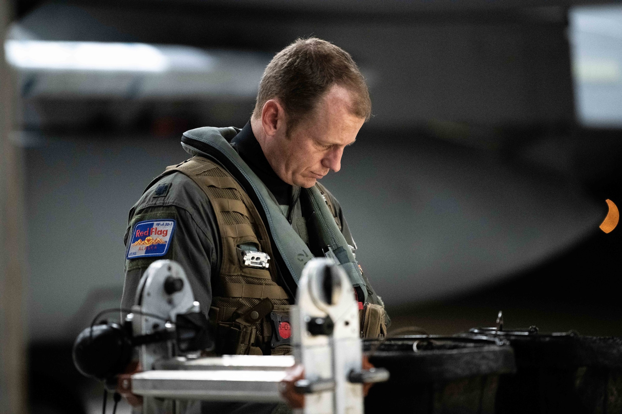 A U.S. Air Force pilot assigned to the 67th Fighter Squadron reviews flight plans for Red Flag-Alaska at Kadena Air Base, Japan, April 15, 2022. Red Flag-Alaska is a Pacific Air Forces-directed field training exercise for U.S. and international forces flown under simulated air combat conditions primarily out of Eielson Air Force Base and Joint Base Elmendorf-Richardson, Alaska. (U.S. Air Force photo by Airman 1st Class Sebastian Romawac)