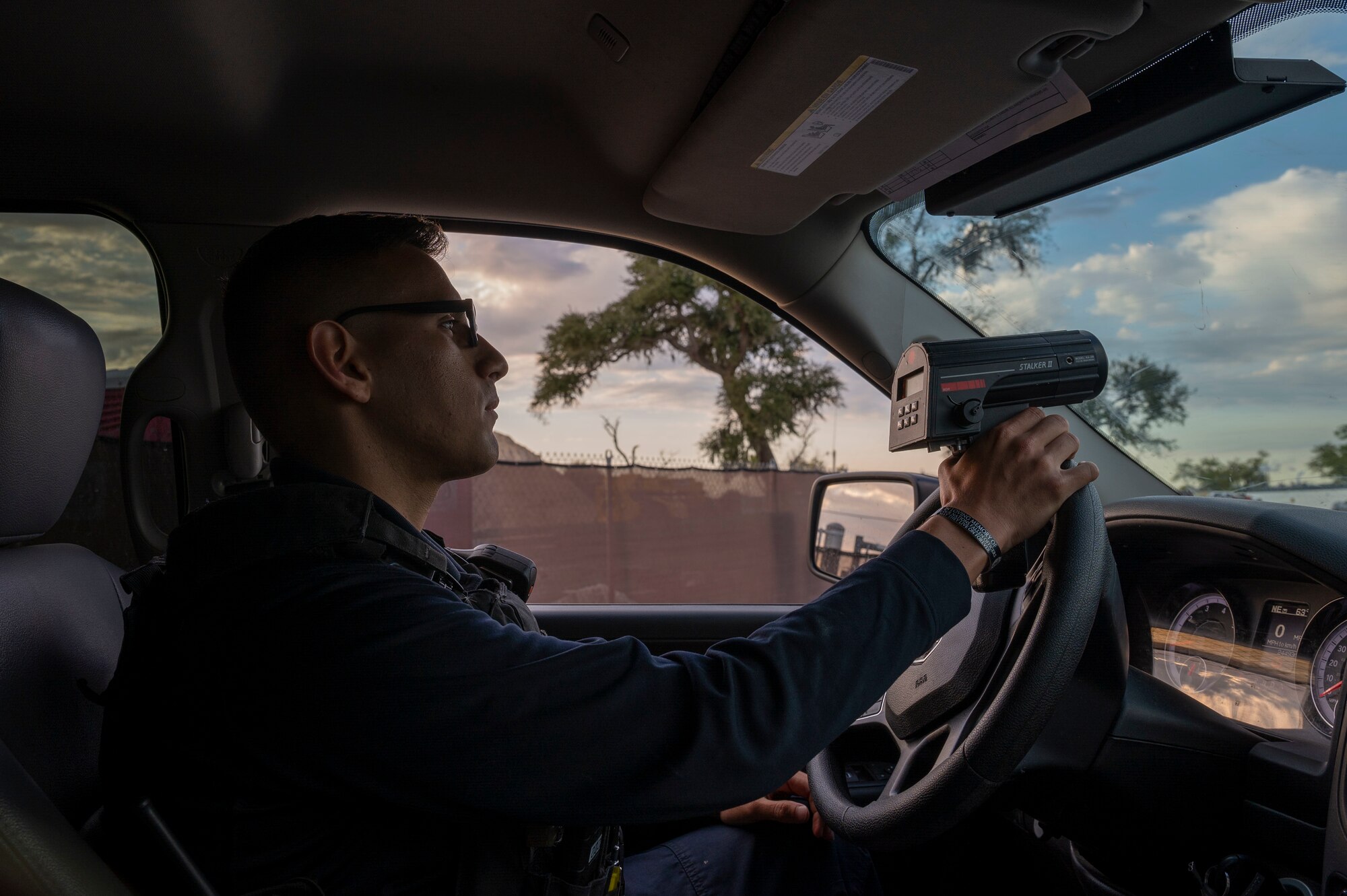 Police officer uses a radar gun